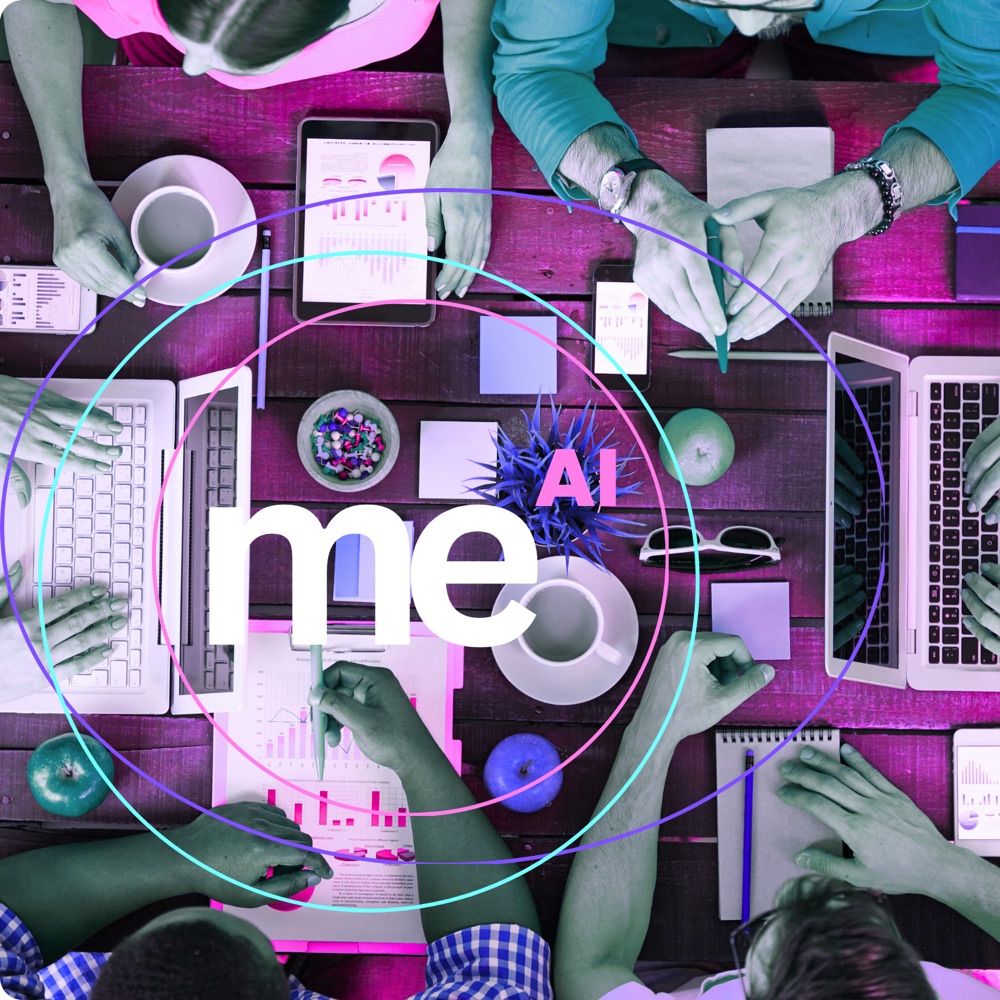 People working at a table with the Futurebraining MeAI mark