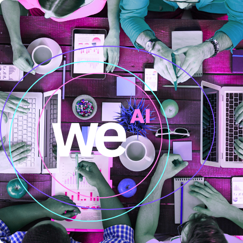 Top-down view of a diverse team working with laptops, tablets, and reports around a table, overlaid with the Futurebraining 'meAI' logo and colorful circular lines.